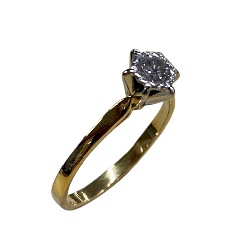 Ladies 18ct Yellow & White Gold Single Stone Diamond Ring. Round Brilliant Cut Diamond Illusion Grain Set With Tapered Gallery With Pointed Swept Up Shoulders. TDW 0.20ct. Size L/6, With Valuation Certificate (NG 142944)
