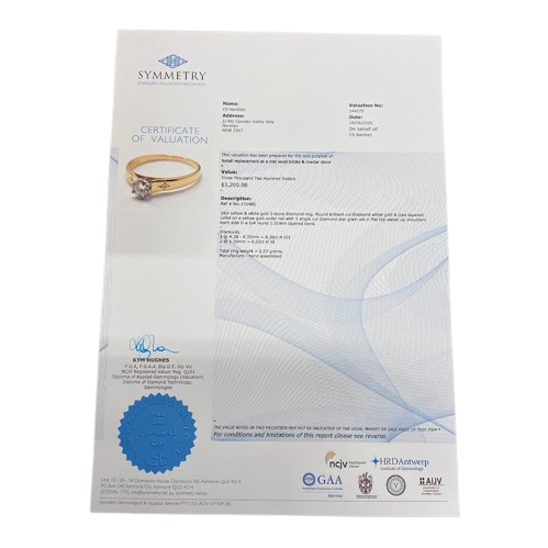 Ladies 18ct Yellow & White Gold 3 Stone Diamond Ring. Round Brilliant Cut 6 Claw Tapered Collet White Gold On A Yellow Gold Under Rail Diamond, With 2 Single Cut Diamonds Star Grain Set In Flat Top Swept Up Shoulders. TDW 0.32ct. Size N/7, With Valuation Certificate (NG 132482)