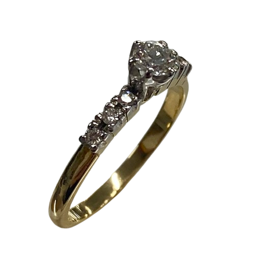 Ladies 18ct Yellow & White Gold Diamond Ring. Single Round 0.20ct Brilliant Cut White Gold Claw Set Diamond, With 6 Round Brilliant Cut White Gold Claw Set Diamonds. TDW 0.29ct. Size L&1/2 . With Valuation Certificate.