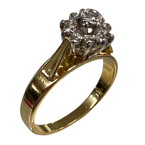 Ladies 18ct Yellow & White Gold Diamond Cluster Ring. Single Round 0.06ct Brilliant Cut White Gold Claw Set Diamond, With 10 Round Brilliant Cut White Gold Illusion Grain Set Diamonds. TDW 0.16ct. Size L&1/2 . With Valuation Certificate.