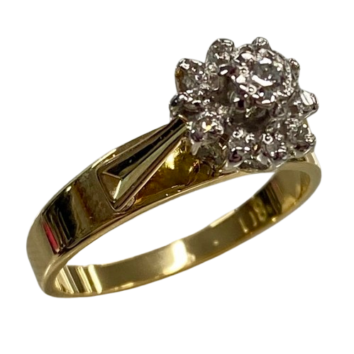 Ladies 18ct Yellow & White Gold Diamond Cluster Ring. Single Round 0.06ct Brilliant Cut White Gold Claw Set Diamond, With 10 Round Brilliant Cut White Gold Illusion Grain Set Diamonds. TDW 0.16ct. Size L&1/2 . With Valuation Certificate.