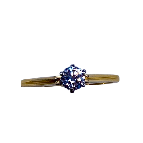 Ladies 18ct Yellow & White Gold Single Stone Diamond Ring. Round Brilliant Cut Diamond White Gold 6 Claw Set With Tapered Pierced Out Collet On Flat Yellow Gold Under Rail With Grooved Swept Up Shoulders. TDW 0.55ct. Size H/4.5, With Valuation Certificate (NG 63624)