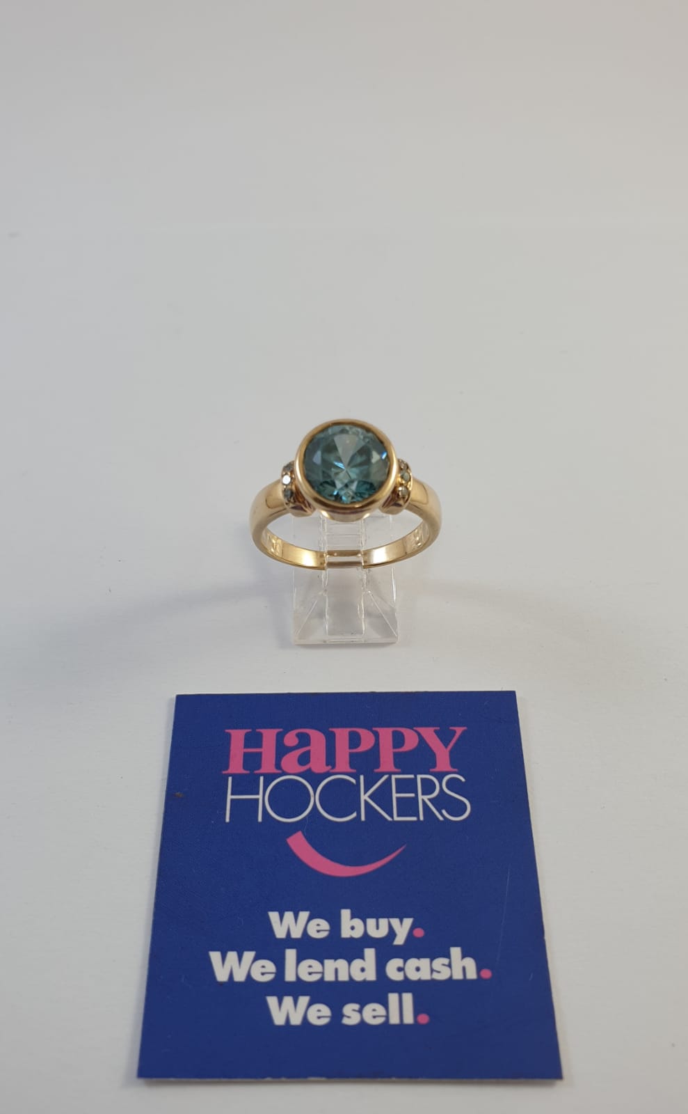 9CT  YELLOW GOLD RING SET WITH BLUE ZIRCON AND 6 X 0.01CT DIAMONDS