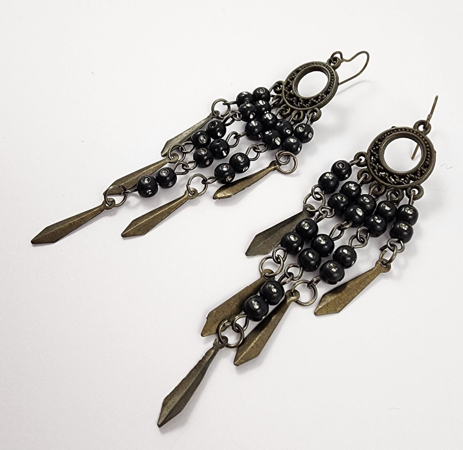 A PAIR OF BLACK METAL COSTUME BEADED FILIGREE DROP EARRINGS