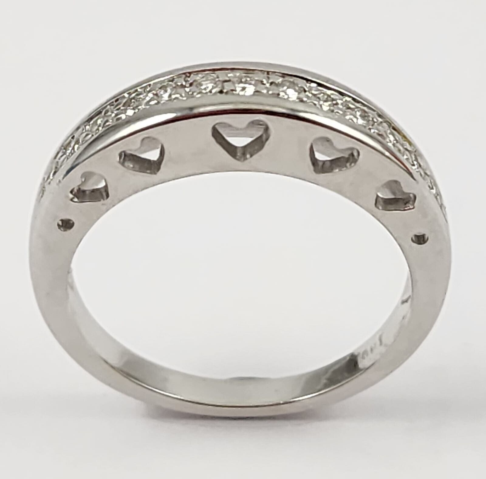14CT WHITE GOLD DIAMOND RING WITH HEART CUTOUTS ON SIDE OF BAND