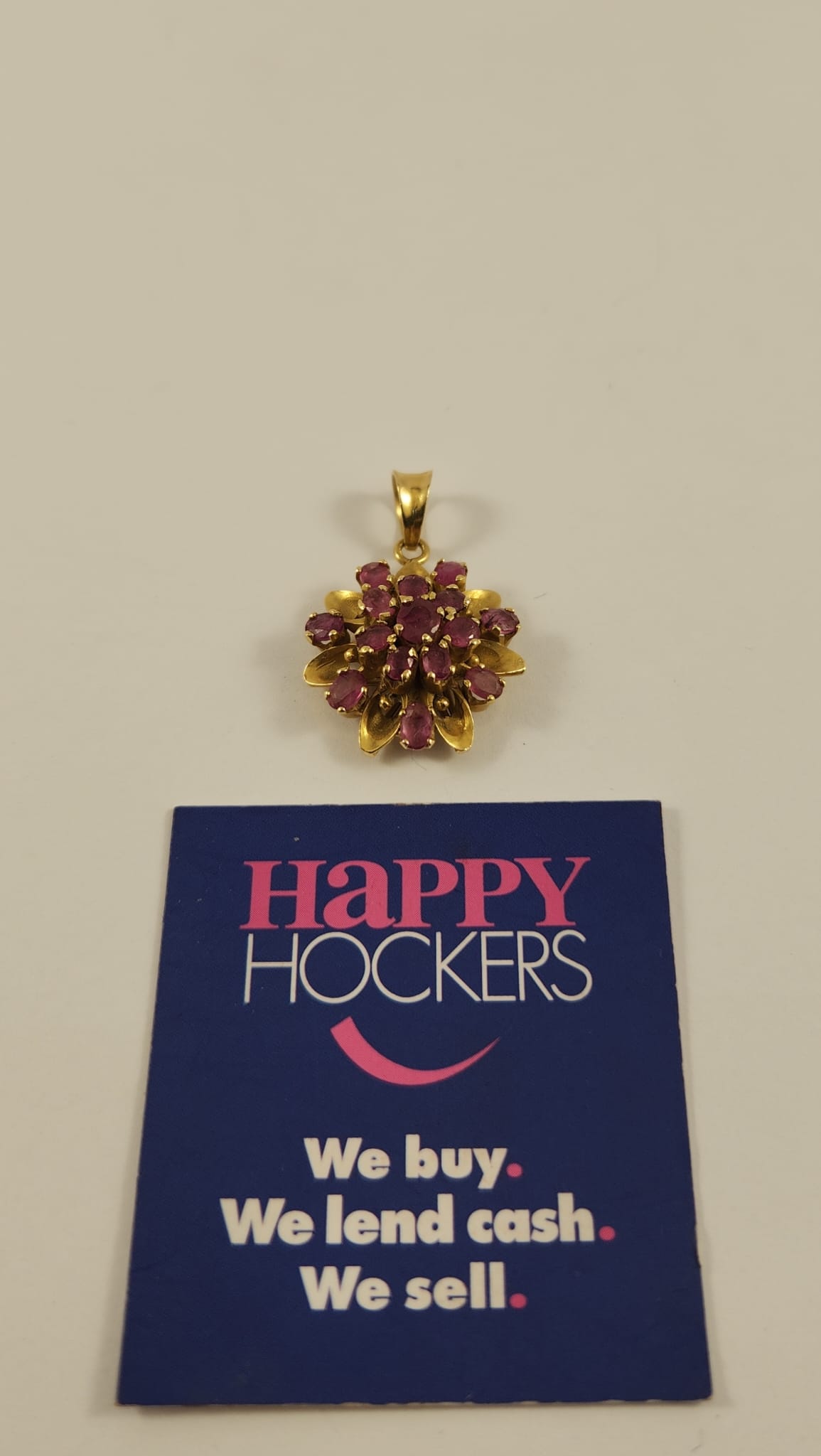 18CT YELLOW GOLD PENDANT SET WITH 15 X NATURAL RUBIES TOTALLING 1.95CT.