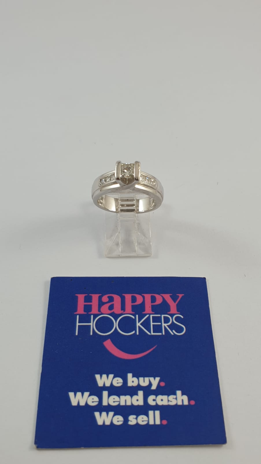 18CT WHITE GOLD RING SET WITH 7  DIAMONDS TOTALLING 0.66CT