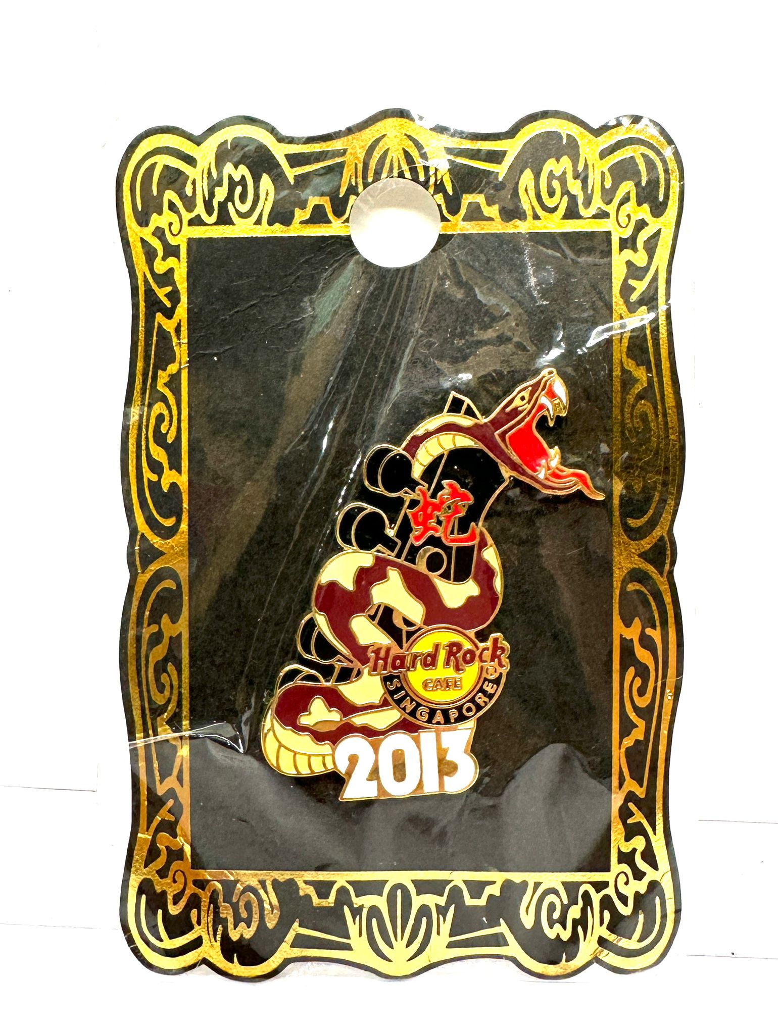 SNAKE WRAPPED AROUND A GUITAR HARD ROCK CAFE COLLECTABLE BADGE SINGAPORE 2013 STILL IN ORIGINAL PACKAGING