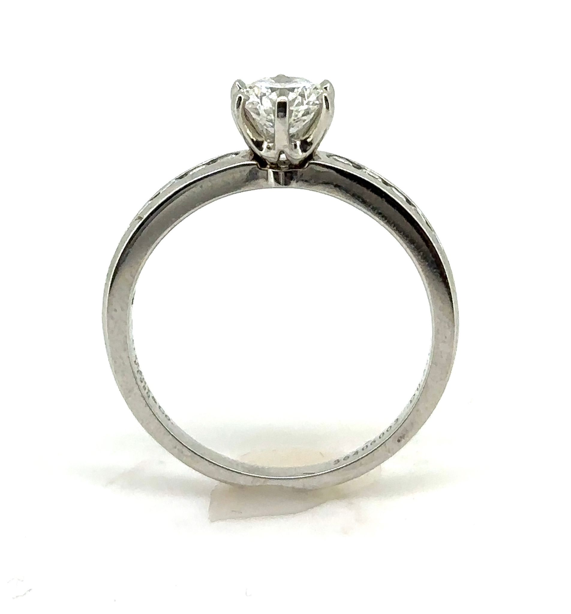 TIFFANY & CO. PLATINUM RING WITH A CHANNEL-SET DIAMOND BAND